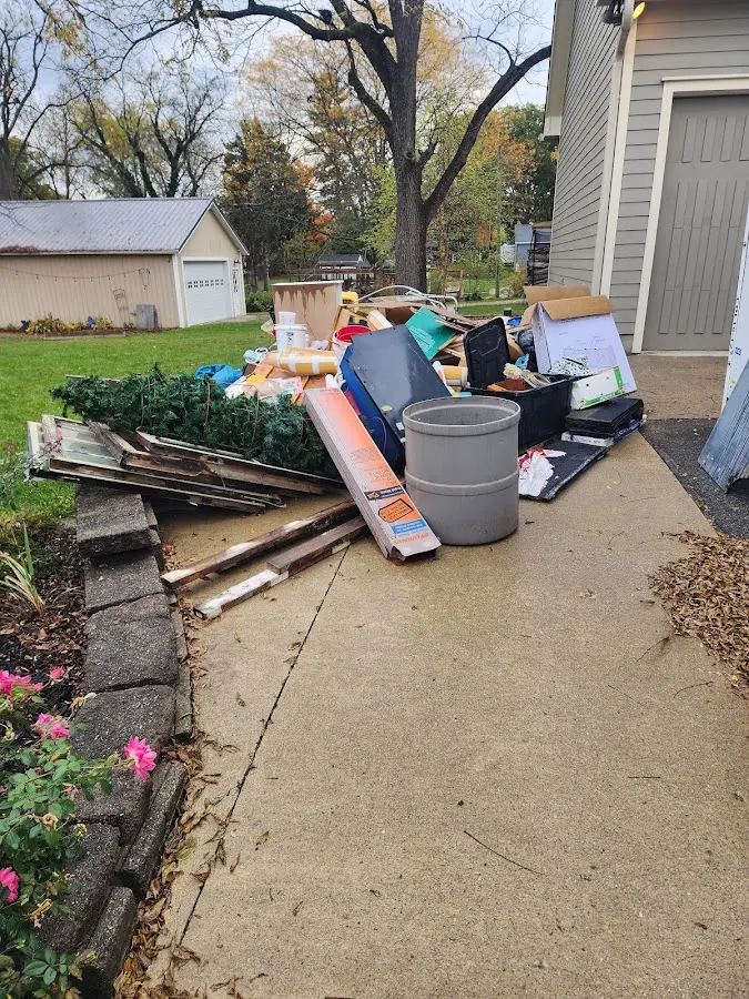 Dumpster being loaded with debris for Commercial Dumpster Rental in Gibraltar